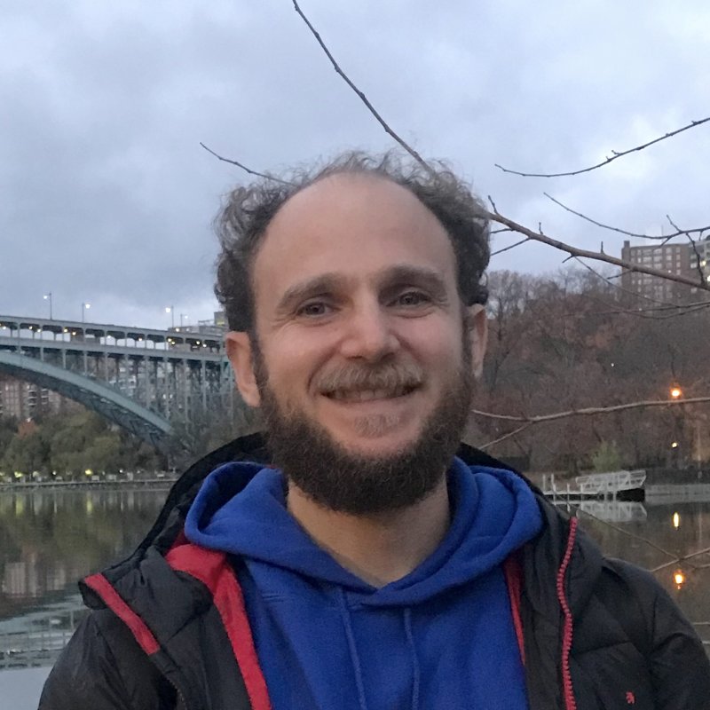 Picture of Luke Joyner smiling in Inwood Hill Park by Spuyten Duyvil Bridge